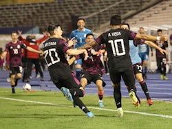 Mexico's Alexis Vega celebrates scoring their second goal with teammates on January 27, 2022