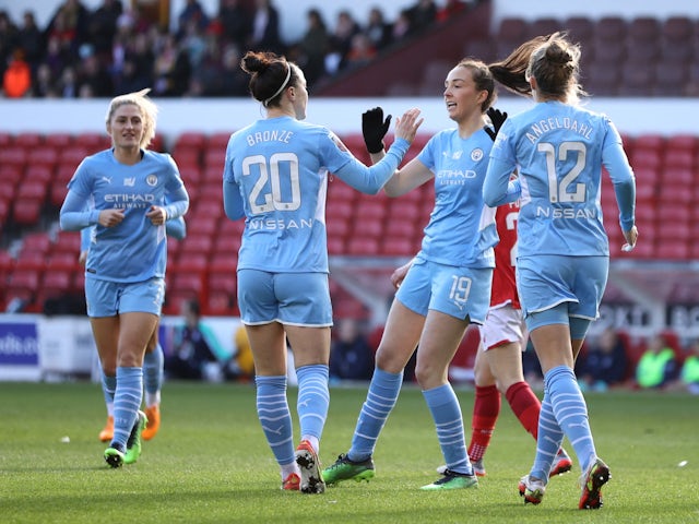Manchester City Women's Caroline Weir celebrates scoring their first goal with Lucy Bronze, Filippa Angeldahl and teammates on January 28, 2022