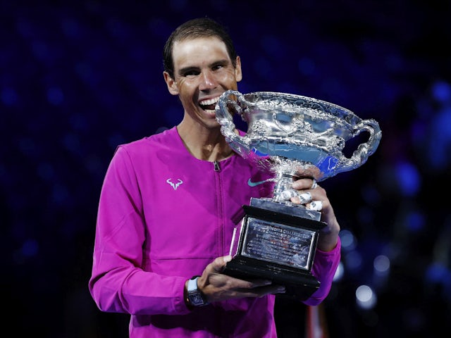 Rafael Nadal celebrates after winning the men's singles Australian Open final with trophy on January 30, 2022
