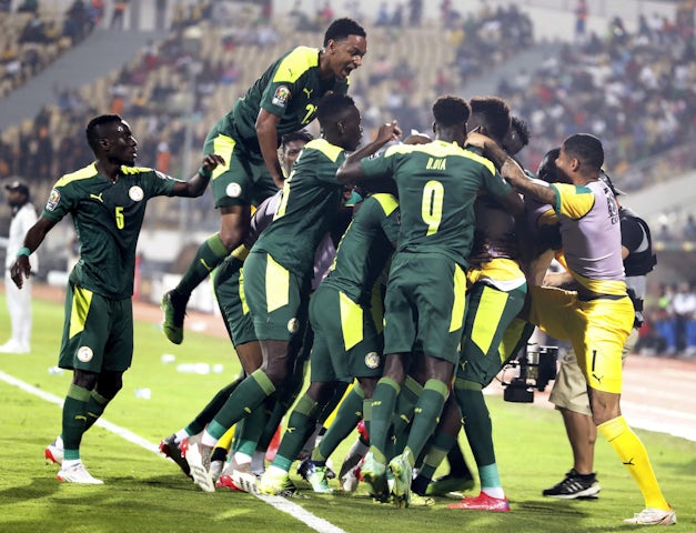 Senegal's Famara Diedhiou celebrates scoring their first goal with teammates on January 30, 2022