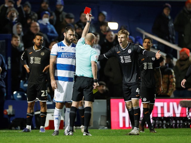 Swansea City's Flynn Downes is sent off for a second yellow card by referee on January 25, 2022