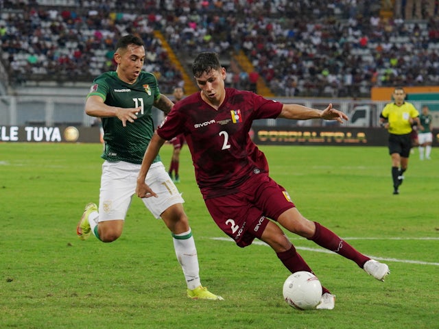 Venezuela's Nahuel Ferraresi in action with Bolivia's Bruno Miranda on January 28, 2022