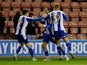 Wigan Athletic's Thelo Aasgaard celebrates scoring their second goal with teammates on December 8, 2021