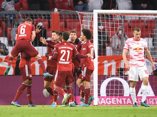 Bayern Munich's Thomas Muller celebrates scoring their first goal with teammates on February 5, 2022