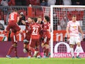 Bayern Munich's Thomas Muller celebrates scoring their first goal with teammates on February 5, 2022