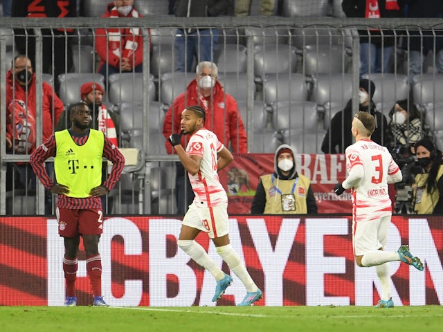 RB Leipzig's Christopher Nkunku celebrates scoring their second goal with Angelino on February 5, 2022