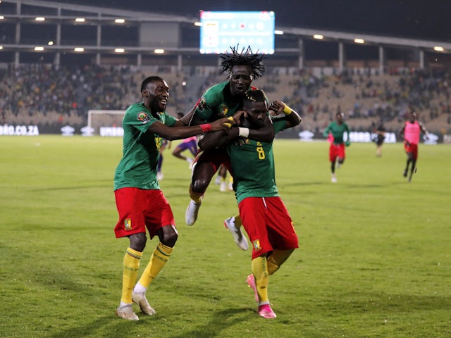 Ambroise Oyongo Vitro of Cameroon celebrates with his teammates after scoring the winning penalty in a shootout on February 5, 2022
