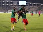 Cameroon's Ambroise Oyongo Bitolo celebrates with teammates after scoring the winning penalty in the shoot-out on February 5, 2022