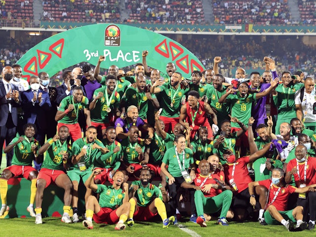 Cameroon celebrate on the podium after finishing in third place at the Africa Cup of Nations on February 5, 2022