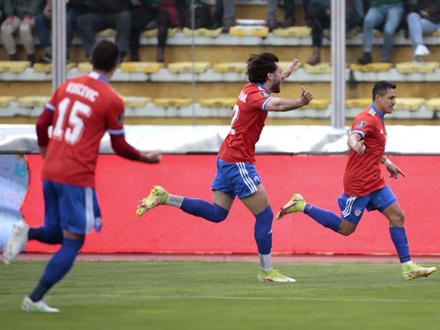 Chile's Alexis Sanchez celebrates scoring their first goal with teammates on February 1, 2022