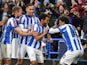 Huddersfield Town's Duane Holmes celebrates scoring their first goal with teammates on February 5, 2022