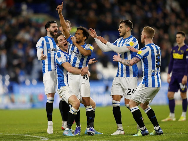 Huddersfield Town's Duane Holmes celebrates scoring their first goal with Carel Eiting on February 2, 2022