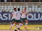 Iraq's Ayman Hussein celebrates scoring their first goal with teammates on February 1, 2022