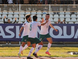 Iraq's Ayman Hussein celebrates scoring their first goal with teammates on February 1, 2022