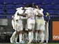 Lyon's Moussa Dembele celebrates scoring their second goal with teammates on February 1, 2022