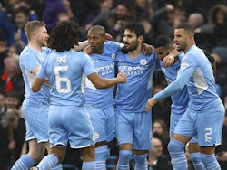 Manchester City's Ilkay Gundogan celebrates scoring their first goal with teammates on February 5, 2022