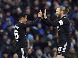 Fulham's Fabio Carvalho celebrates scoring their first goal with Tim Ream on February 5, 2022