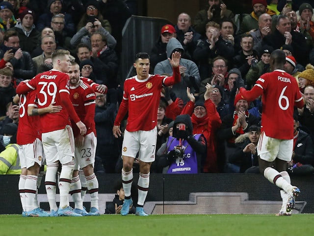 Manchester United's Cristiano Ronaldo celebrates after Jadon Sancho scores their first goal  on February 4, 2022
