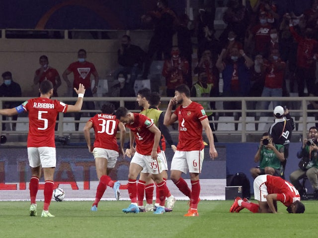 Al Ahly's Mohamed Hany celebrates scoring their first goal with teammates on February 5, 2022