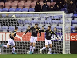 Oxford United's Matt Taylor celebrates scoring their first goal with teammates on February 1, 2022
