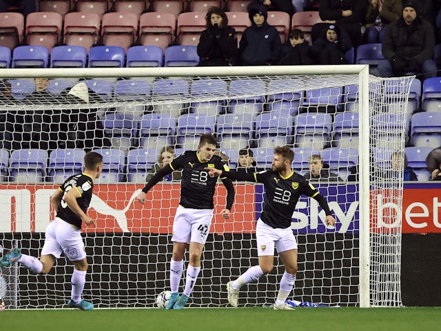 Oxford United's Matt Taylor celebrates scoring his first goal alongside his teammates on 1 February 2022