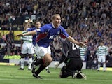 Rangers' Peter Lovenkrands celebrates scoring the winning goal in the Scottish Cup final against Celtic on May 4, 2002 