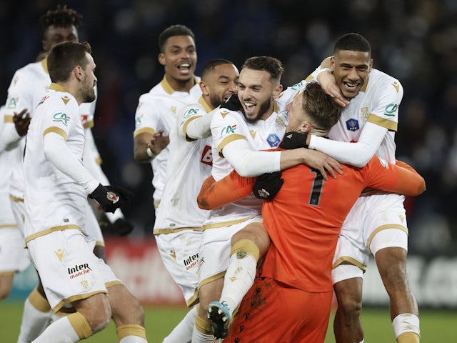 Nice's Jean-Clair Todibo, Marcin Bulka and teammates celebrate winning the match after a penalty shootout on January 31, 2022