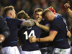 Scotland's Ben White celebrates scoring their first try with teammates on February 5, 2022