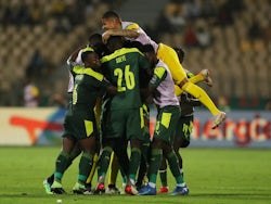 Senegal's Abdou Diallo celebrates scoring their first goal with teammates on February 2, 2022