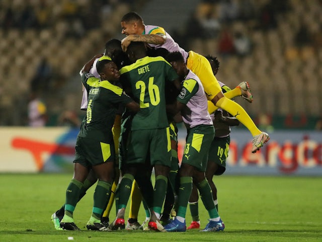 Senegal's Abdou Diallo celebrates scoring their first goal with teammates on February 2, 2022