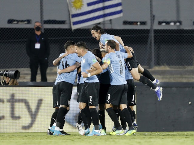 Uruguay's Rodrigo Bentancur celebrates scoring their first goal with teammates on February 1, 2022