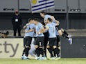 Uruguay's Rodrigo Bentancur celebrates scoring their first goal with teammates on February 1, 2022