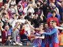 Barcelona's Gavi celebrates scoring their second goal with teammates on February 6, 2022