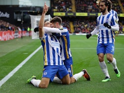 Brighton & Hove Albion's Neal Maupay celebrates scoring their first goal with Adam Lallana and Marc Cucurella on February 12, 2022