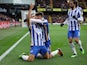 Brighton & Hove Albion's Neal Maupay celebrates scoring their first goal with Adam Lallana and Marc Cucurella on February 12, 2022