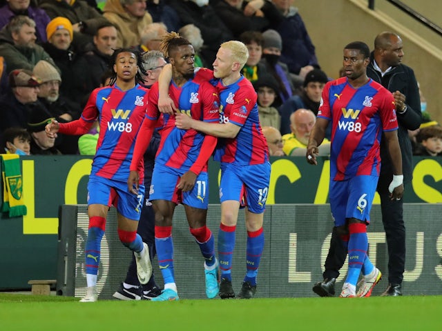 Crystal Palace's Wilfried Zaha celebrates scoring their first goal with teammates on February 9, 2022