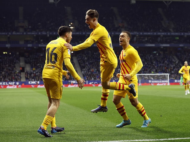 Barcelona's Pedri celebrates scoring their first goal with teammates on February 13, 2022