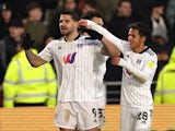 Fulham's Aleksandar Mitrovic celebrates scoring their first goal with teammates on February 12, 2022