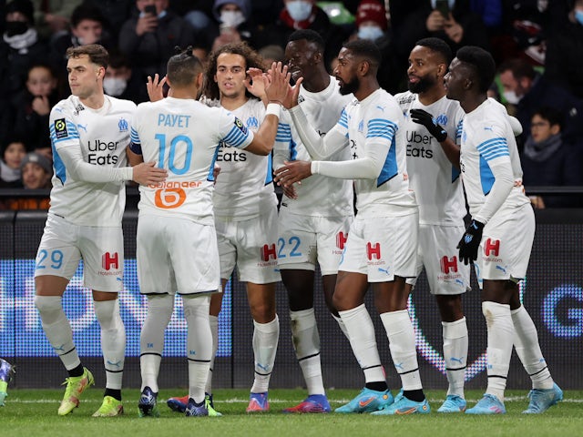 Marseille's Cedric Bakambu celebrates scoring their first goal with teammates on February 13, 2022