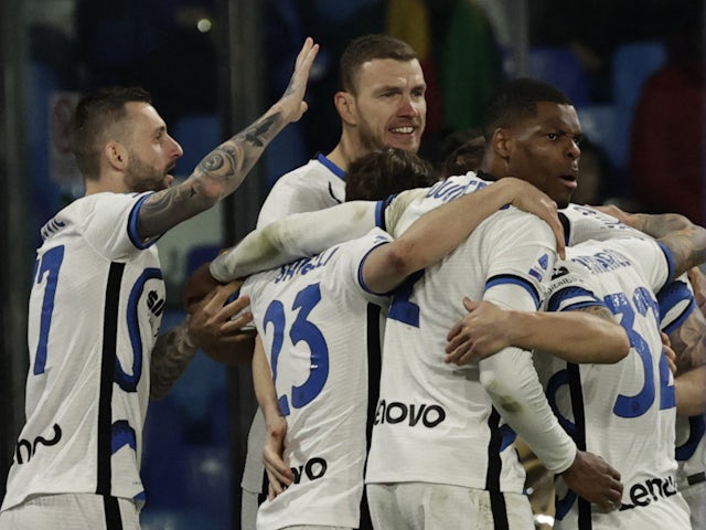 Inter Milan's Edin Dzeko celebrates scoring their first goal with teammates on February 12, 2022