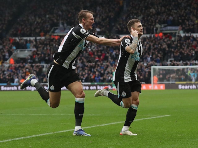 Newcastle United's Kieran Trippier celebrates scoring their first goal with Dan Burn on February 13, 2022