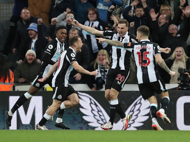 Newcastle United's Ryan Fraser celebrates scoring their second goal with Joe Willock, Chris Wood and Kieran Trippier on February 8, 2022