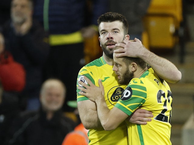 Norwich City's Teemu Pukki celebrates scoring his first goal with Grant Hanley on February 9, 2022