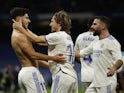 Real Madrid's Marco Asensio celebrates scoring their first goal with Luka Modric on February 6, 2022