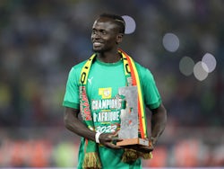 Liverpool and Senegal's Sadio Mane celebrates with the Africa Cup of Nations Player of the Tournament award on February 6, 2022
