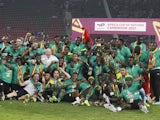 Senegal players celebrate with the trophy after winning the Africa Cup of Nations on February 6, 2022