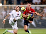 Paris St Germain's Mauro Icardi in action with Lille's Sven Botman on August 1, 2021