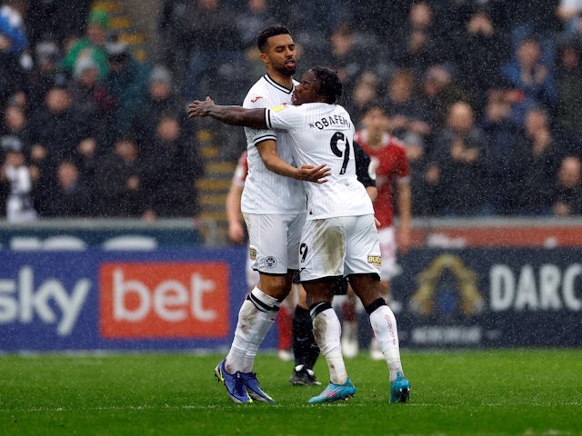 Swansea City's Michael Obafemi celebrates scoring their first goal on February 13, 2022