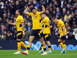 Wolverhampton Wanderers' Raul Jimenez celebrates scoring their first goal with Ruben Neves on February 13, 2022