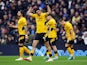 Wolverhampton Wanderers' Raul Jimenez celebrates scoring their first goal with Ruben Neves on February 13, 2022